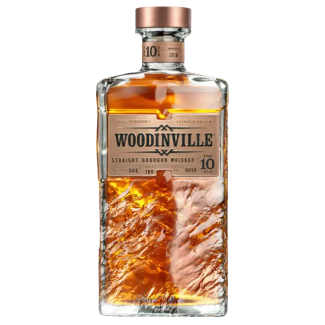Bottle of Woodinville Straight Bourbon Whiskey Aged 10 Years 100 Proof with copper cap and textured glass