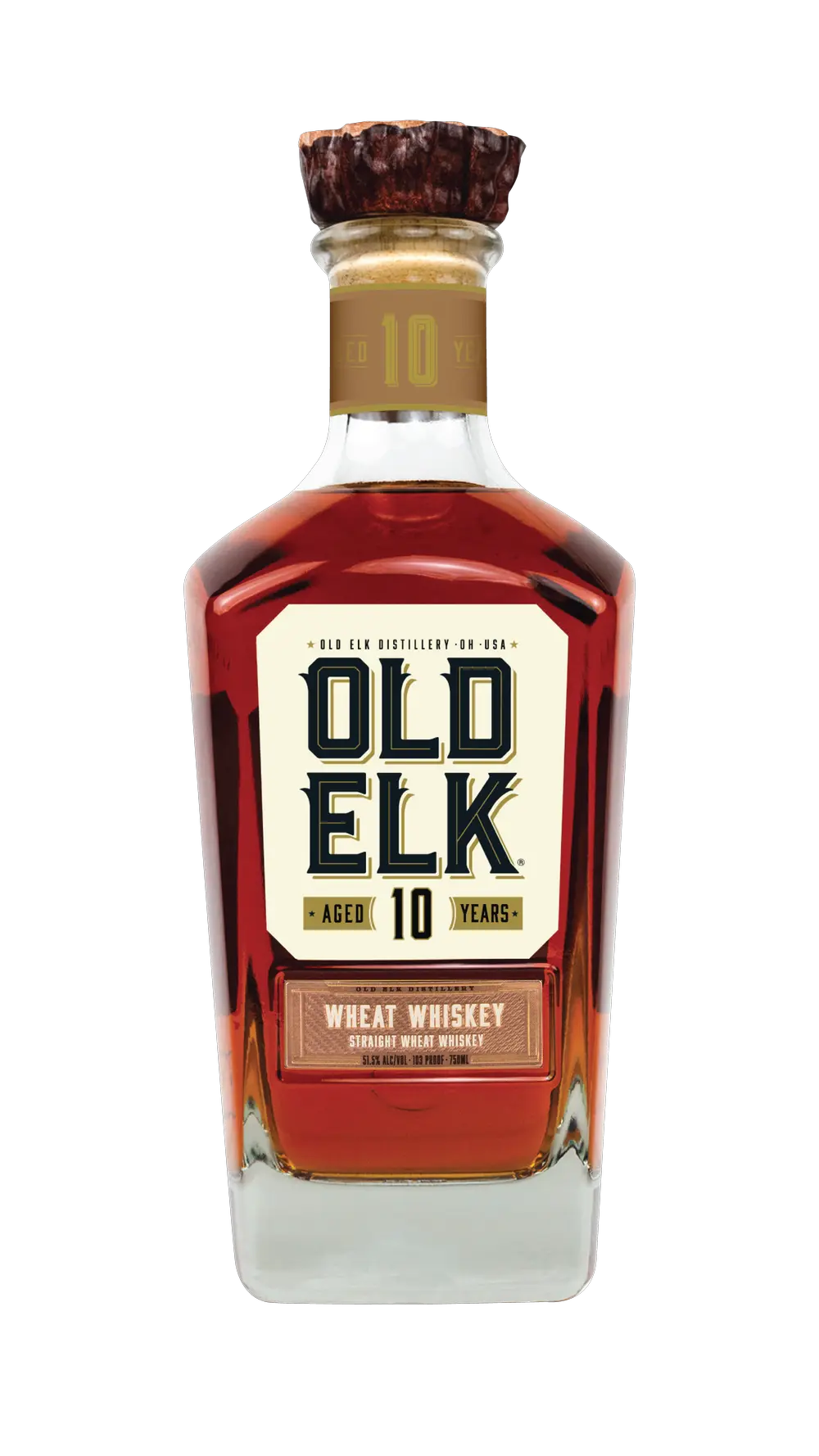 A bottle of Old Elk Bourbon’s 10 Year Straight Wheat Whiskey, adorned with a wooden cap and a cream label accented by bold dark lettering and gold highlights—this premium American whiskey exemplifies refined craftsmanship and character.