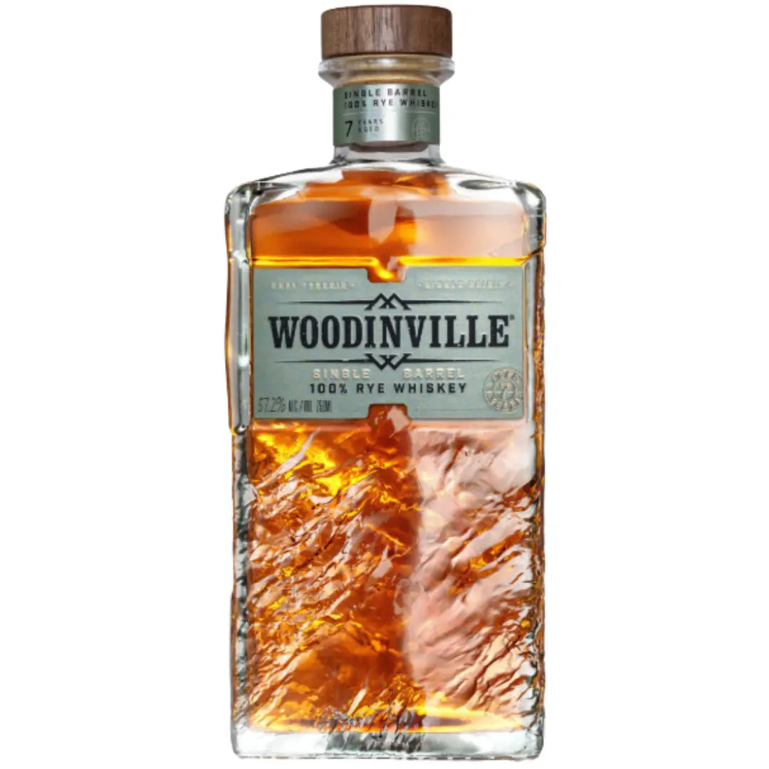 A clear glass bottle of Woodinville Single Barrel 100% Rye Whiskey Aged 7 Years (700mL) with a gold cap, amber liquid, and a textured front label featuring the Woodinville brand and product details.
