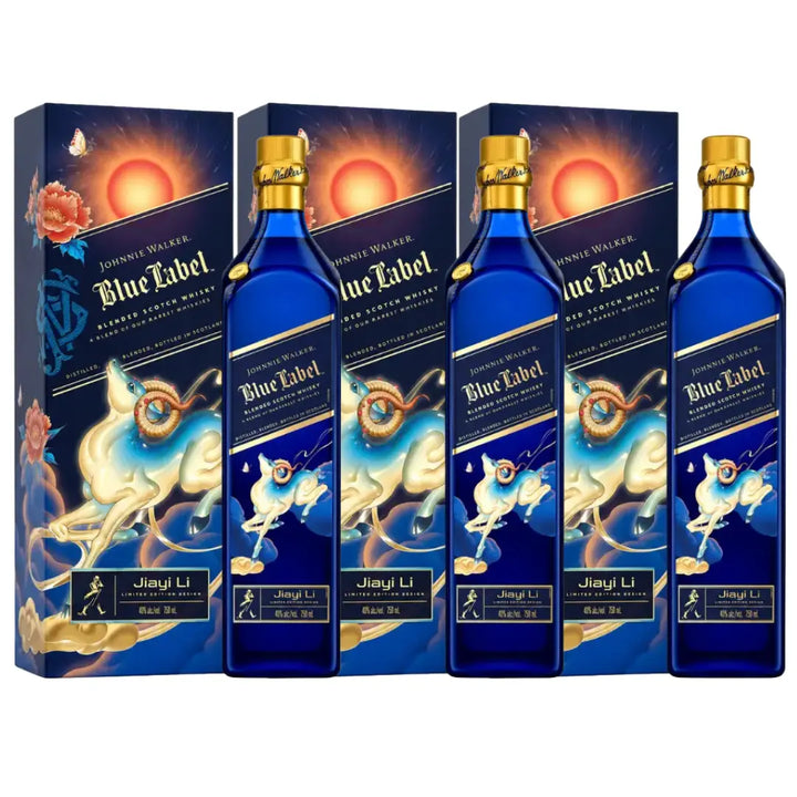 Four blue bottles of Johnnie Walker Blue Label Year of The Goat Lunar New Year by JiaYi Li are displayed with their decorative boxes, featuring celestial and goat-themed designs in gold and orange accents.