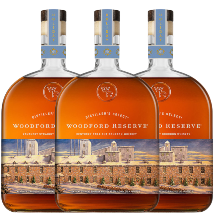 Three bottles of Woodford Reserve are lined up, featuring the Woodford Reserve Bourbon Holiday Edition 2026 750ml with festive labels and a distillery illustration.