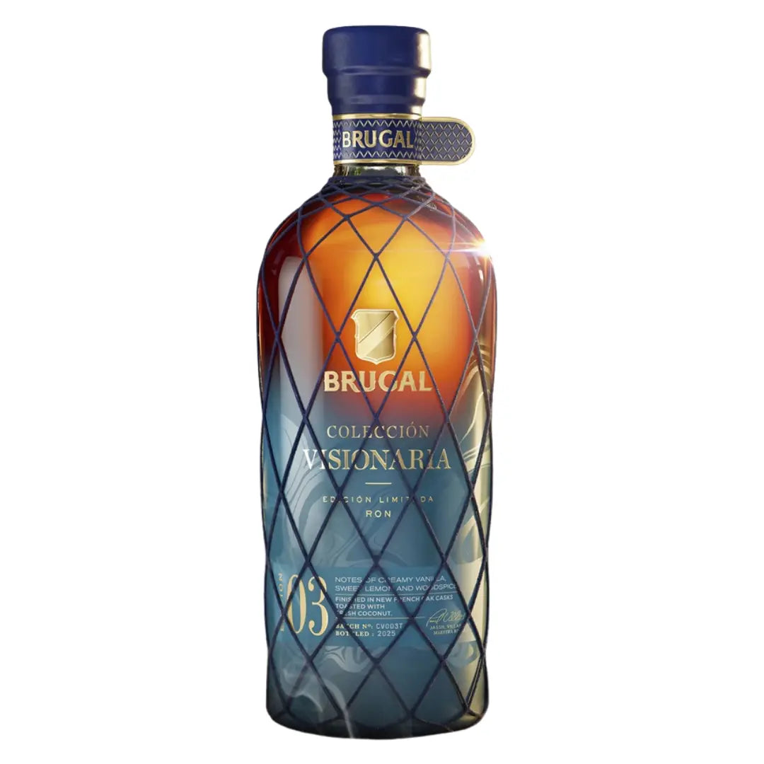 A bottle of Brugal Colección Visionaria Edición 03 Coconut Limited Edition Rum by Brugal 1888 Rum from the Dominican Republic features a striking blue and amber gradient design, elegant gold text, and a sophisticated lattice pattern overlay on the glass.