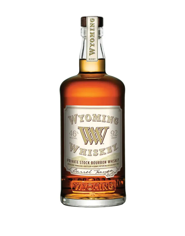 A bottle of Wyoming Whiskey Private Stock Bourbon Whiskey Barrel Harvest Edition 92 Proof, with a cream and gold label featuring the Wyoming Whiskey brand, stands upright against a white background.