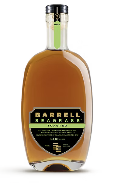 A bottle of Barrell Toasted Seagrass Rye Whiskey 124.02 Proof by Barrell Craft Spirits, featuring a gold cap and a green and black label with cask strength details. The whiskey inside has a rich amber color.