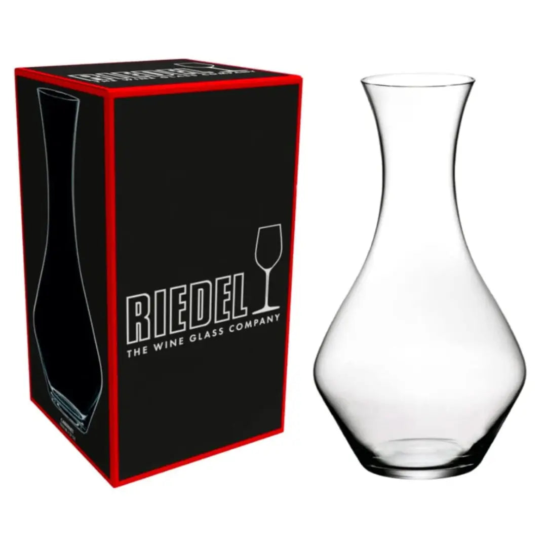 The RIEDEL Wine Decanter Cabernet Sauvignon by Riedel is displayed beside its black and red box, which features the brand’s logo and a wine glass icon—an elegant choice for serving Cabernet Sauvignon.
