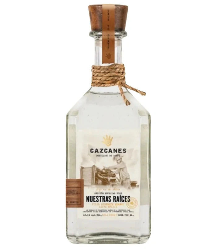 Cazcanes Nuestras Raíces Still Strength Blanco Tequila 2026 by Cazcanes Tequila features a clear glass bottle with wooden cork and vintage-style label, twine-wrapped neck, and is crafted as a limited-edition collector’s piece.