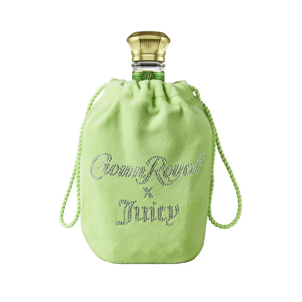 The Crown Royal Regal Apple x Juicy Couture Limited Edition comes in a light green velvet bag with rhinestone-style “Crown Royal x Juicy” lettering and a gold bottle cap, celebrating this unique collaboration.