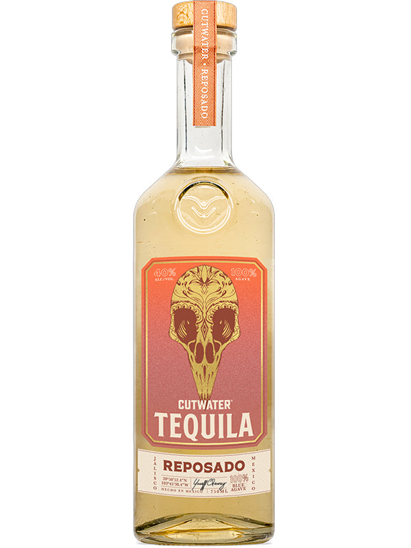 A bottle of Cutwater Spirits' Cutwater Reposado Tequila features a cork top and an orange label with a stylized animal skull, highlighting its Jalisco origins, 100% Blue Weber Agave, and 40% ABV.