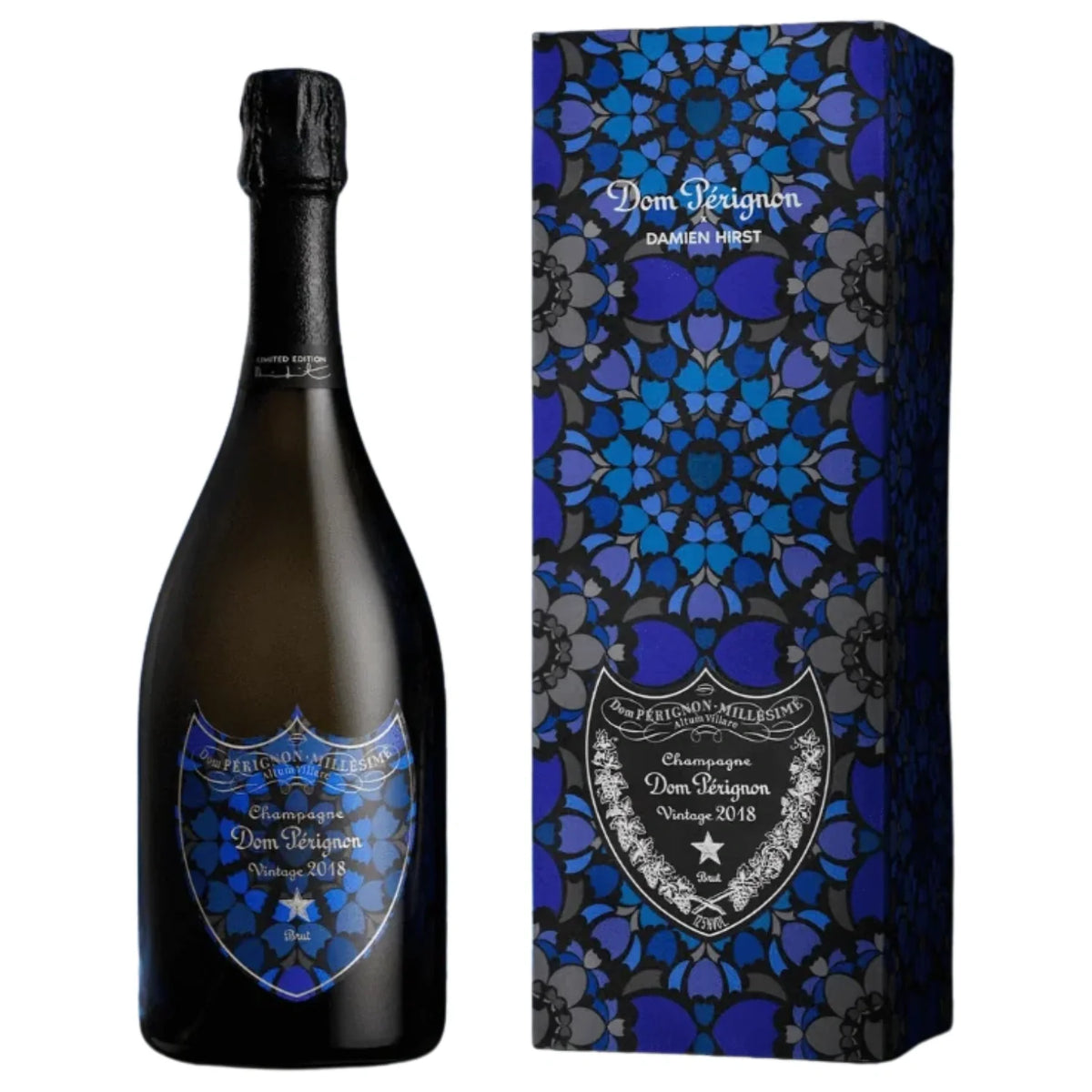 A bottle of Dom Pérignon Vintage 2018 Damien Hirst Limited Edition Brut Champagne and its gift box, both featuring a dark blue and black geometric floral pattern and matching labels.