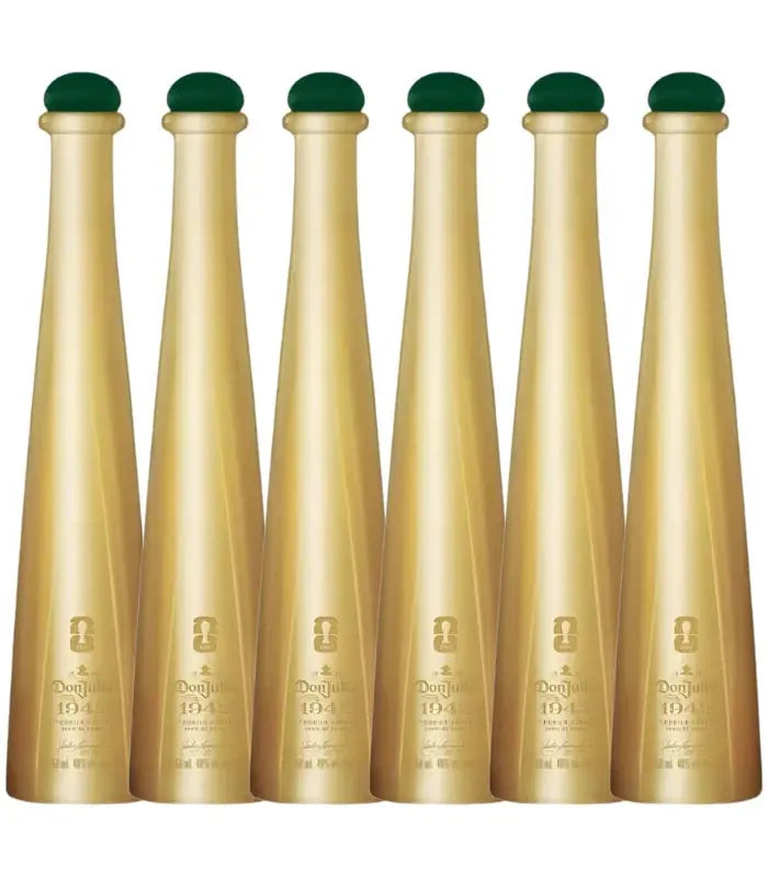 Six gold-colored bottles with green tops are lined up, each labeled Don Julio 1942 FIFA World Cup 2026 Limited Edition 50mL by Don Julio, featuring embossed details on the front.