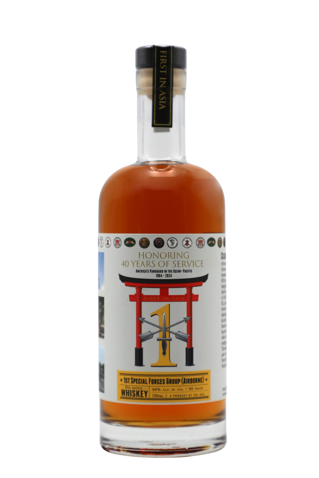 Heritage Distilling’s 1st Special Forces Group Whiskey (8th Edition) features a label with "Honoring 40 Years of Service," a red torii gate, Special Forces Group insignia, and a black neck label reading "First in Asia.