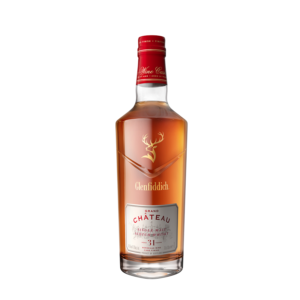 A bottle of Glenfiddich 31 Year Old Grand Chateau Bordeaux Wine Cask Finish single malt Scotch, featuring a red cap, gold stag logo, and clear label with red and gold accents, displayed on a plain white background.