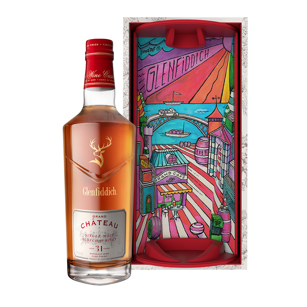 A bottle of Glenfiddich 31 Year Old Grand Chateau Bordeaux Wine Cask Finish stands beside a vibrant, illustrated gift box with a cityscape design and the Glenfiddich logo at the top.