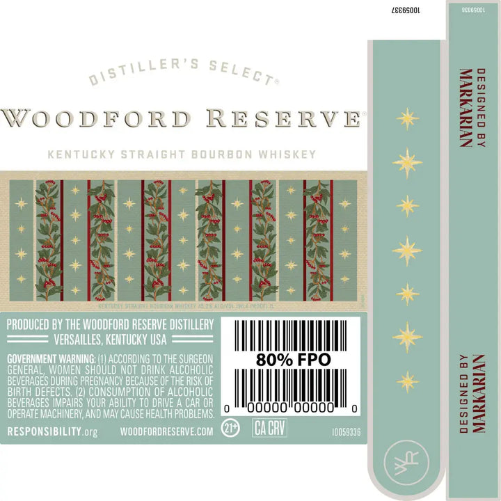 A label for the Woodford Reserve Holiday Edition Bourbon 2025 “Designed by Markarian” 3 Pack features vertical green and red holiday stripes with gold stars, holly, berries, product info, warnings, and design credit to Markarian.