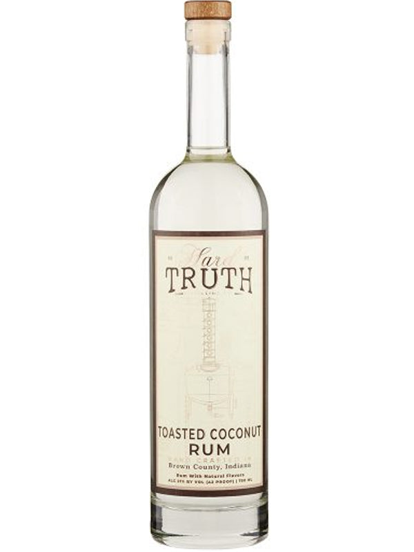 A clear glass bottle with a cork top labeled Hard Truth Toasted Coconut Rum from Hard Truth features a simple distillery still line drawing—ideal for mixing tropical cocktails with this flavorful toasted coconut rum.