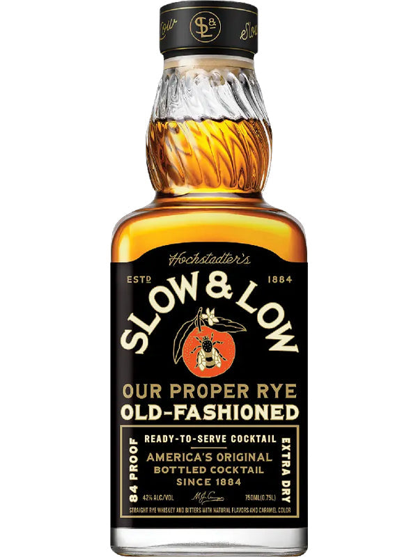 A bottle of Hochstadter's Slow & Low Proper Rye Old Fashioned, featuring black and gold labeling with a red-orange logo, is a ready-to-drink Old Fashioned rye whiskey cocktail from Hochstadter's.