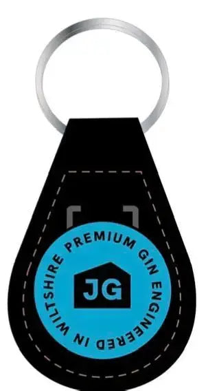 The James Gin The Hedge 2 Bottle Bundle w/ Souvenir Gift Key Chain by James Gin US includes a stylish black keyring with a blue badge reading “PREMIUM GIN ENGINEERED IN WILTSHIRE”—ideal for British craft gin and James May fans.