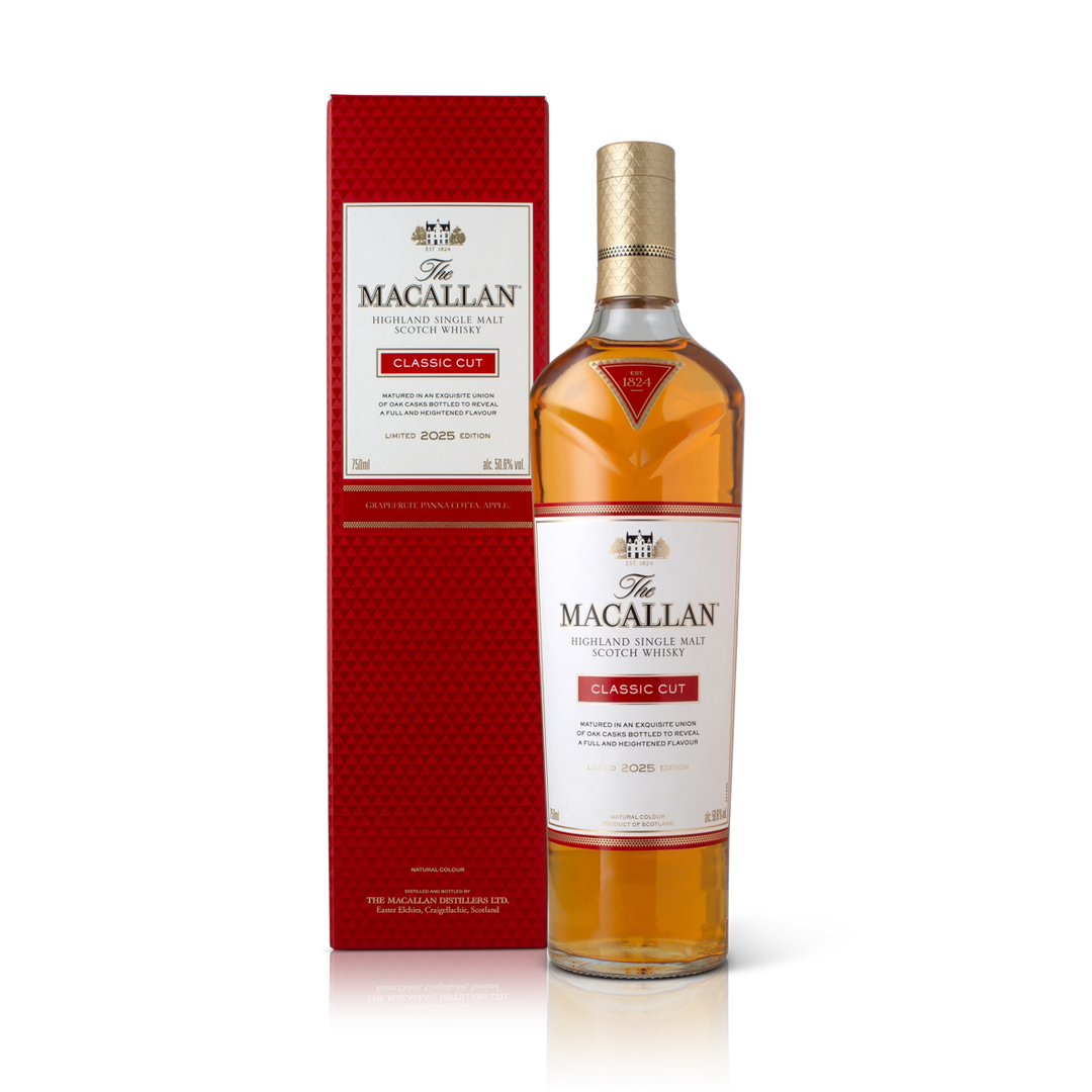 A bottle of The Macallan Classic Cut 2025 Single Malt Scotch Whisky stands beside its red and white box, both featuring gold accents and label details from The Macallan, highlighting this limited release.