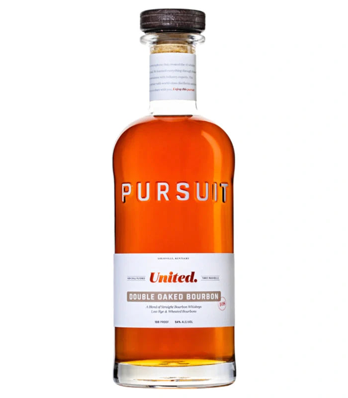 A clear 700mL bottle of Pursuit United Double Oaked Bourbon by Pursuit Spirits features amber liquid, a wooden cap, and a white label with the brand name and Straight Bourbon Whiskey details in red and black text.