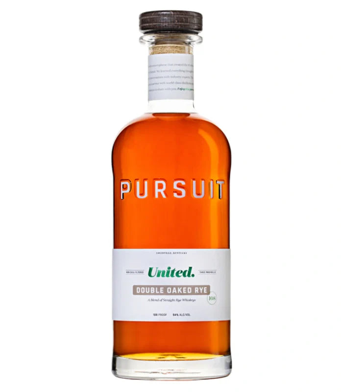 A clear glass 700mL bottle of Pursuit United Double Oaked Rye Whiskey by Pursuit Spirits holds amber rye whiskey and features a wooden cap and white, green, and gold label detailing this unique blend.