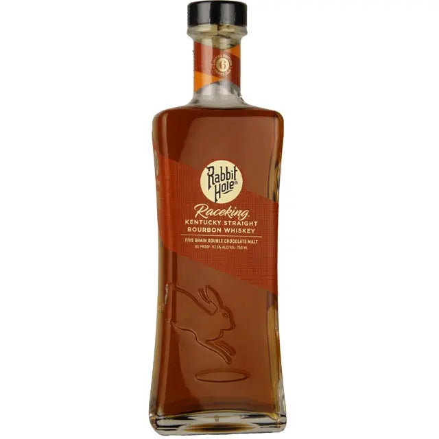 A bottle of Rabbit Hole Raceking 6 Year Kentucky Straight Bourbon Whiskey from Rabbit Hole Distillery, featuring an etched rabbit logo and an orange diagonal label with gold and white text that highlights the craftsmanship behind this limited edition bourbon.