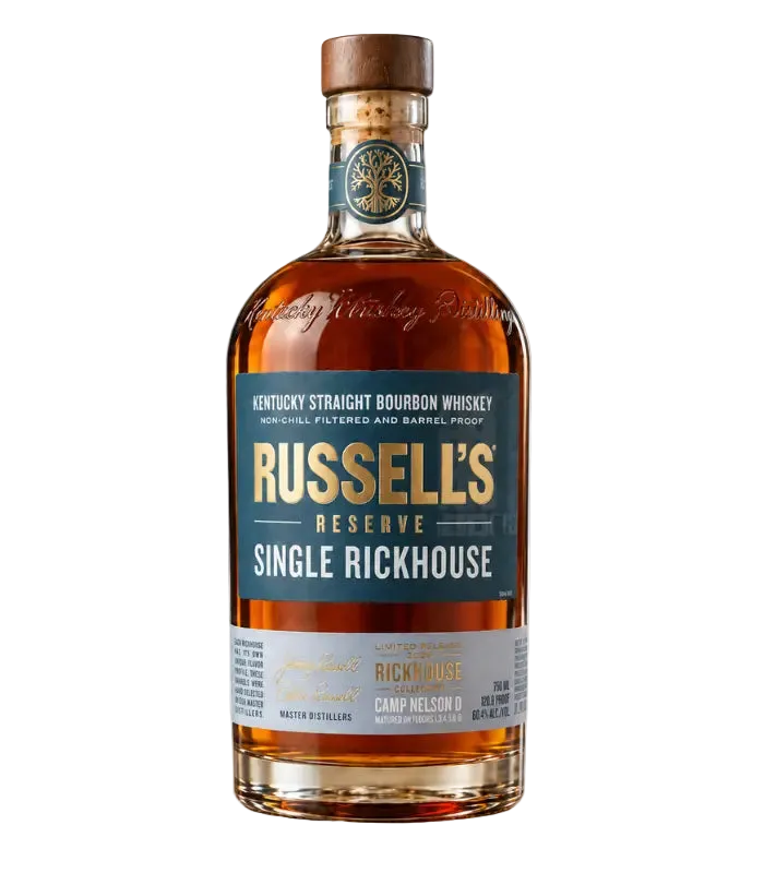 A bottle of Russell’s Reserve Single Rickhouse 2026 Camp Nelson D Bourbon Whiskey with a brown cap, gold and white lettering, and clear amber liquid in clear glass, set against a white background.