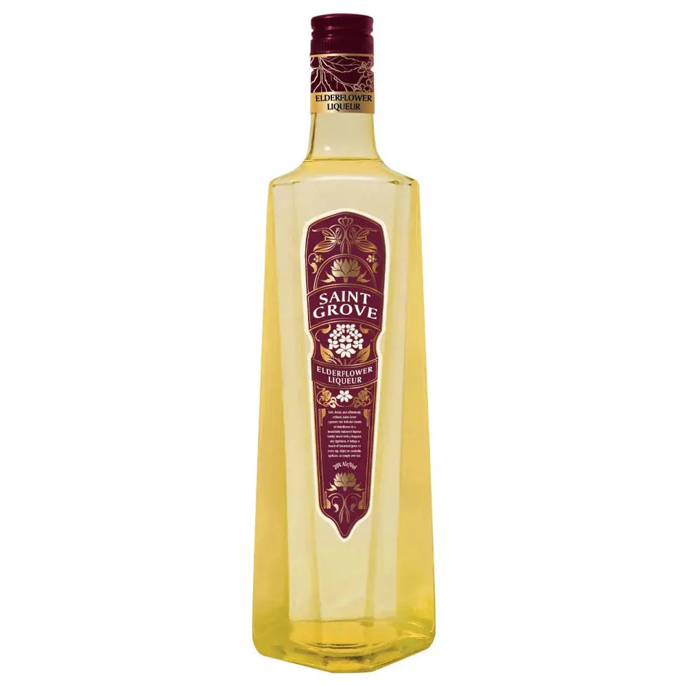 A tall, hexagonal bottle of Saint Grove Elderflower Liqueur with gold-yellow liquid and a maroon and gold label is displayed against a white background—an elegant cocktail ingredient from Saint Grove.