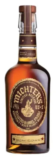 A bottle of Michter's US-1 Toasted Barrel Finish Sour Mash Kentucky Straight Whiskey 2025 Limited Edition with a dark label, gold lettering, and a wax-sealed cap.