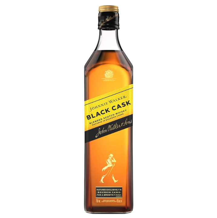 A tall, rectangular bottle of Johnnie Walker Black Cask Blended Scotch Whisky with a black cap and amber liquid, featuring the iconic walking man on a yellow and black label—matured in American oak bourbon casks for rich flavor.