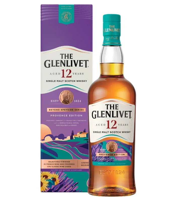 A bottle of The Glenlivet 12 Year Provence Edition Single Malt Scotch Whisky 750mL stands beside its vibrant box decorated with purple hills, yellow fields, and lavender illustrations.