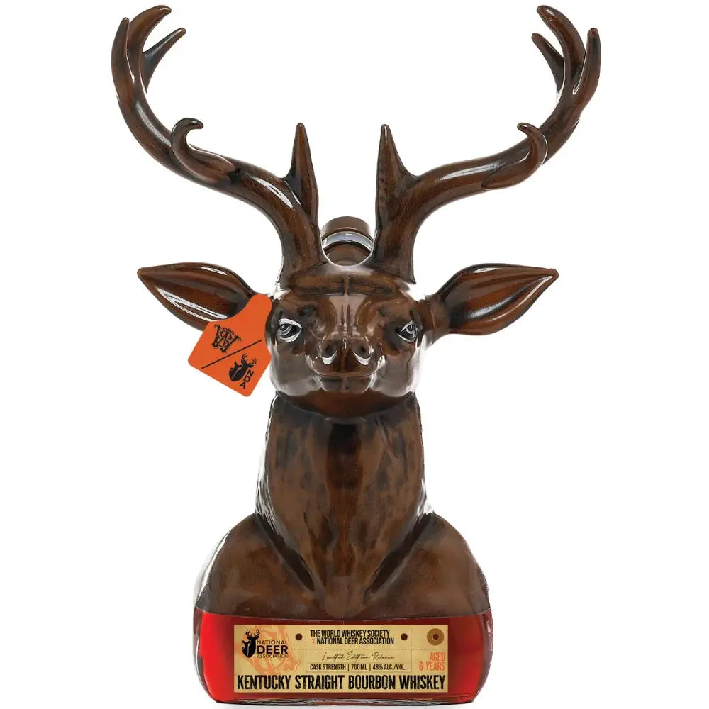 A collectible World Whiskey Society x National Deer Association Kentucky Straight Bourbon Whiskey 700mL decanter, crafted in brown ceramic and shaped like a deer head with antlers, featuring a red tag on its ear and a label at the base—an ideal piece for whiskey enthusiasts.
