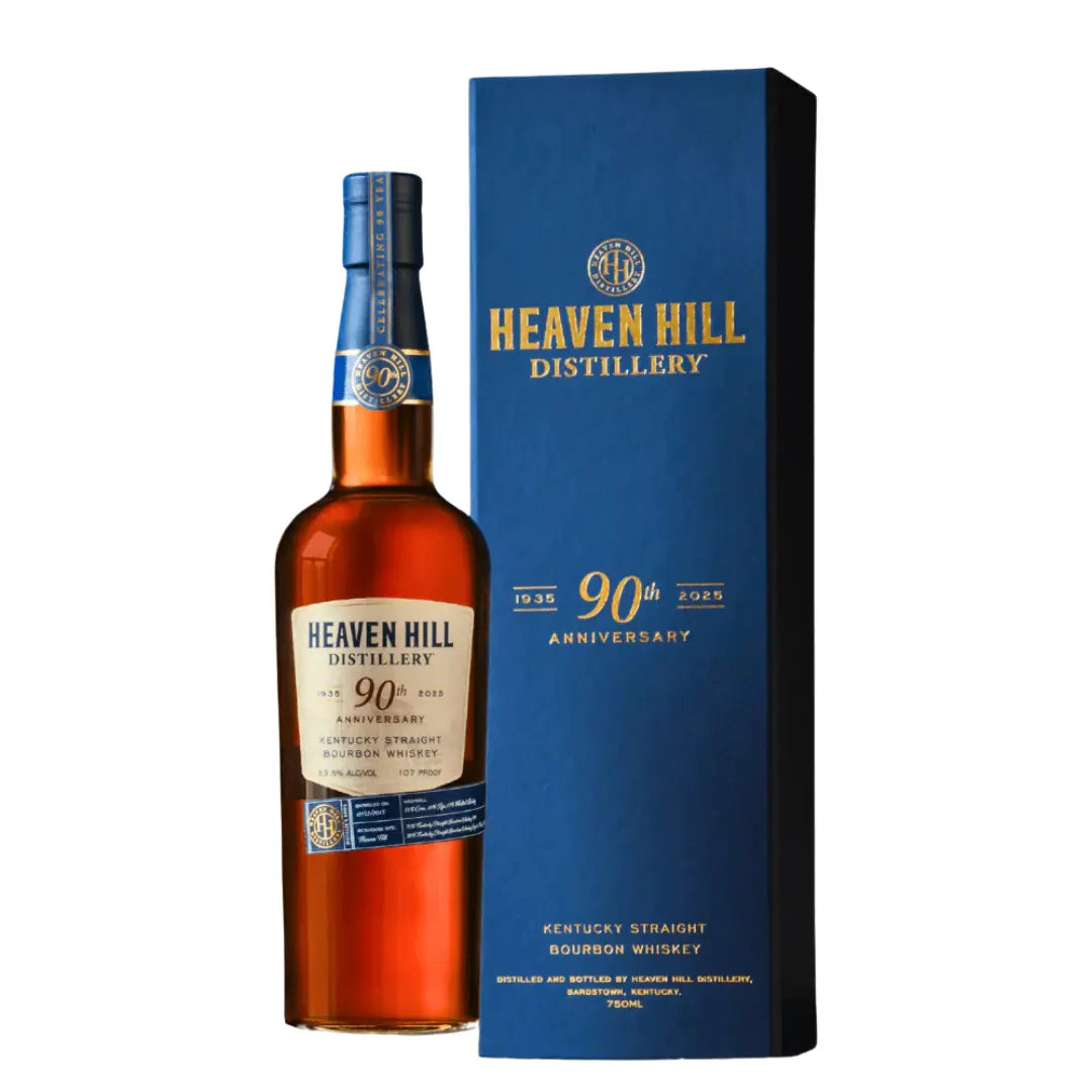 A bottle of Heaven Hill Distillery's 90th Anniversary 9 Year Old Kentucky Straight Bourbon Whiskey 750ml stands beside its blue and gold box, both featuring branded logos and special celebratory details for this limited release.