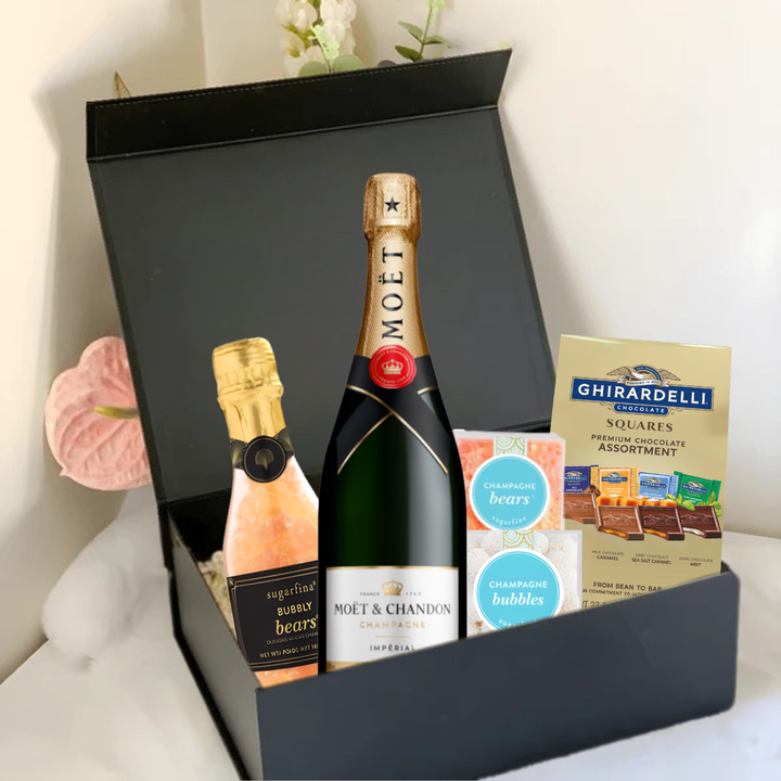 The Premium Champagne Gift Box by Main Street Liquor includes a Moët &amp; Chandon bottle, small bubbles bottle, Sugarfina champagne gummy bears, champagne bubbles candies, and Ghirardelli chocolates—a perfect luxury gift.