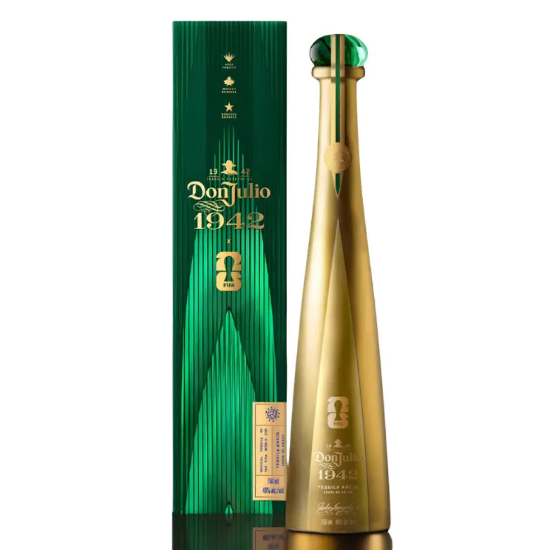 A tall, elegant gold bottle of Don Julio 1942 FIFA World Cup 2026 Limited Edition (PRE-ORDER) stands beside its matching green and gold box, both featuring the Don Julio Tequila logo and premium branding.