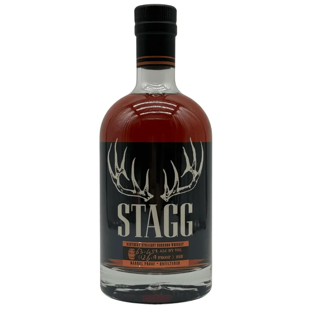 A bottle of Buffalo Trace Stagg Kentucky Straight Bourbon Whiskey Batch 25B 126.9 Proof features a dark label with antlers above bold STAGG text and holds rich amber bourbon for a robust, full-flavored barrel proof experience.