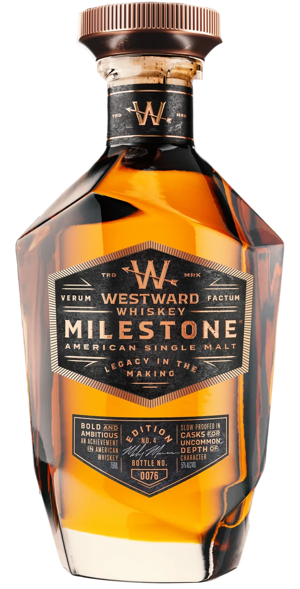 A bottle of Westward Whiskey Milestone Edition No. 4 American Single Malt (Pre-Order), a limited release from Westward, features a striking geometric design with amber liquid visible inside and showcases detailed labeling along with signature Westward branding.