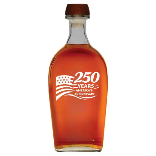 The Elijah Craig Small Batch 250 Years America Deep Etched 750mL by Memory Bottles is a glass bottle of bourbon with a stylized flag logo and “250 Years America’s Anniversary” in white, custom engraved and topped with a wooden cap.