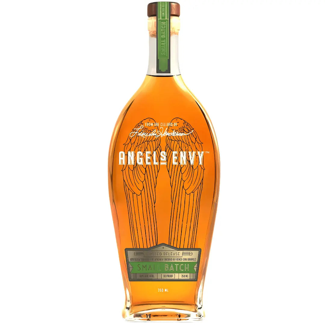 A tall, clear bottle of Angel's Envy Unique & Rare Rye Whiskey Finished In French Oak Barrels features etched angel wings, a green “Small Batch” label, brown cap with green seal, and rich amber Kentucky straight rye whiskey inside.