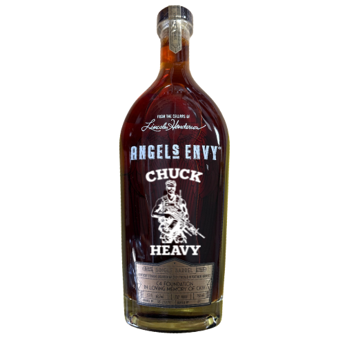 A specially etched Angel's Envy Chuck Heavy C4 Foundation bourbon bottle featuring a custom “CHUCK HEAVY” label, soldier illustration, and tribute text honoring a fallen hero; designed with the C4 Foundation.