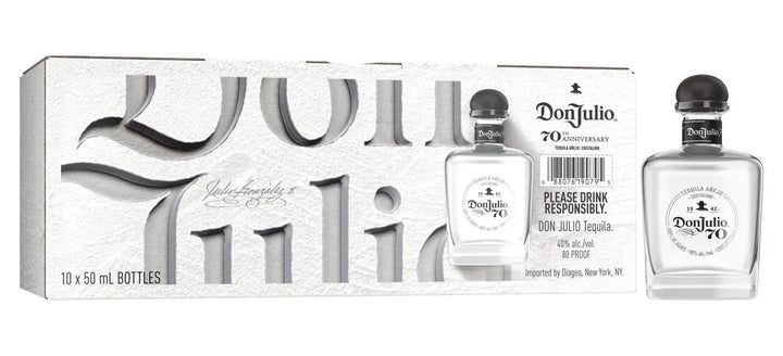 Don Julio Tequila 70 Cristalino Añejo Tequila 50ml (10 Pack) comes in white embossed packaging with bold black text, featuring two clear mini bottles with black caps.