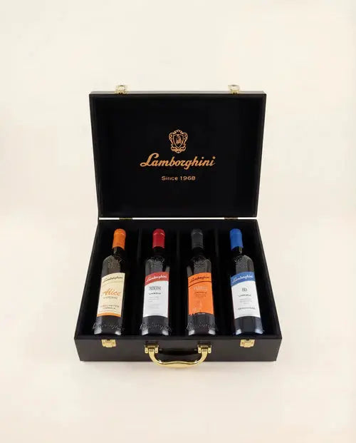 The Lamborghini Ultimate Wine Gift Set by Lamborghini Wine &amp; Spirits Collections features four wines—Trescone, Era, Taurus, and Alice—in a black luxury gift case with gold accents, each bottle sporting a unique label for an exquisite Italian present.