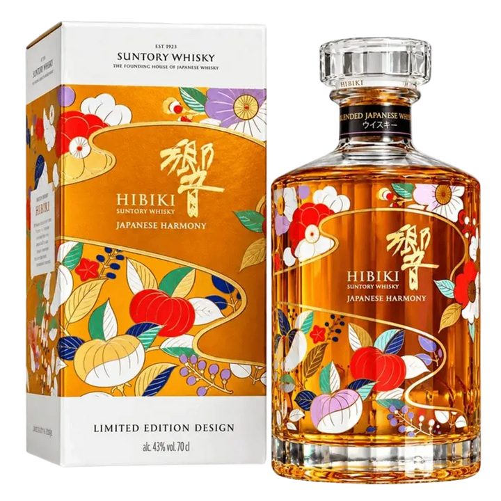 A bottle of Hibiki Japanese Harmony Chiso 2026 Limited Edition Blended Japanese Whisky 750mL and its box, both featuring a gold-toned label with colorful botanical illustrations of flowers and fruit.