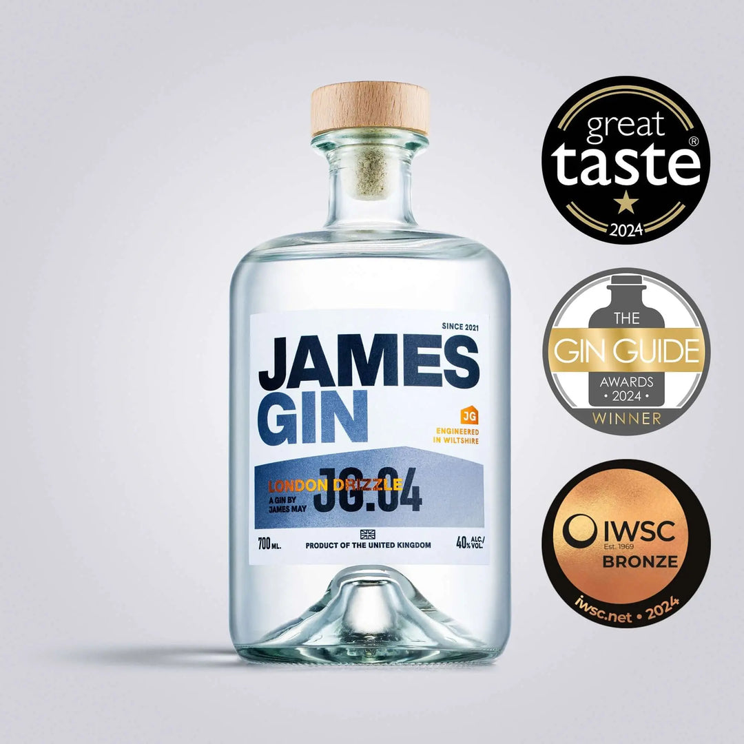 A 700mL bottle of James Gin London Drizzle (80 Proof) with a gift key chain is shown with bold blue and orange labeling, wooden cap, and award badges: Great Taste 2024, Gin Guide Awards Winner 2024, IWSC Bronze 2024.