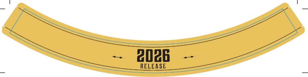 A curved gold band with "2026 RELEASE" in bold black letters at the center, accented by delicate decorative lines above and below—an elegant detail ideal for highlighting Yellowstone 2026 Limited Edition Bourbon Finished in Ruby and Tawny Port Casks.