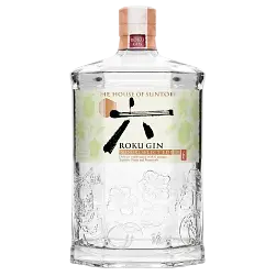 A clear, hexagonal glass bottle of Suntory Roku Gin Minori Select Edition, limited edition Japanese gin, with decorative embossing, a white label with Japanese characters and botanicals, and a wooden cap topped by a red seal.