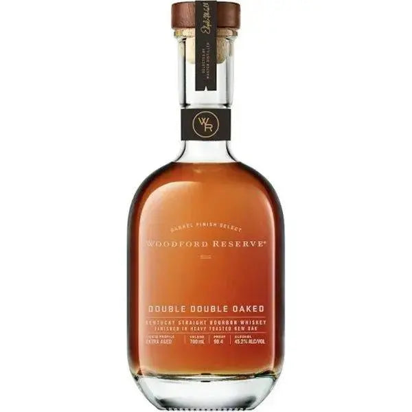 A bottle of Woodford Reserve Double Double Oaked Kentucky Straight Bourbon, featuring a rounded shape, amber liquid, a label with the brand and product name, plus a dark brown cap and neck tag.