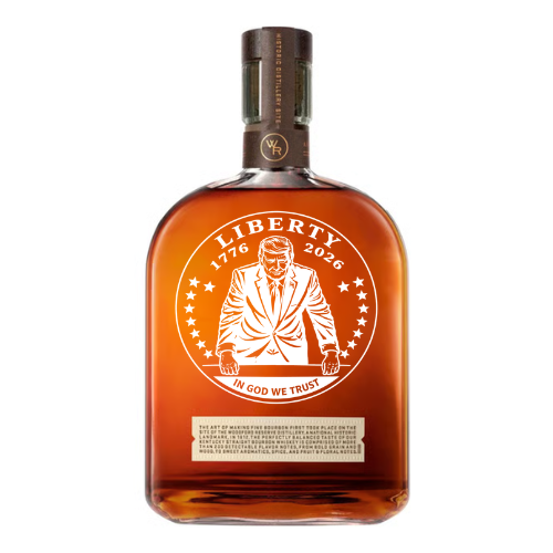The Memory Bottles Woodford Reserve Liberty Mint Custom Etched Bourbon features a suit-clad figure with stars, “LIBERTY 1776 2026” and “IN GOD WE TRUST” on the label, a brown cap, and amber bourbon inside.
