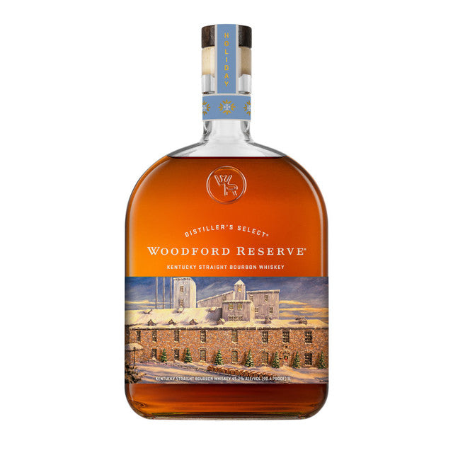 A bottle of Woodford Reserve Bourbon Holiday Edition 2026 750ml, featuring a winter-themed label with a distillery scene and snowflakes on the neck.