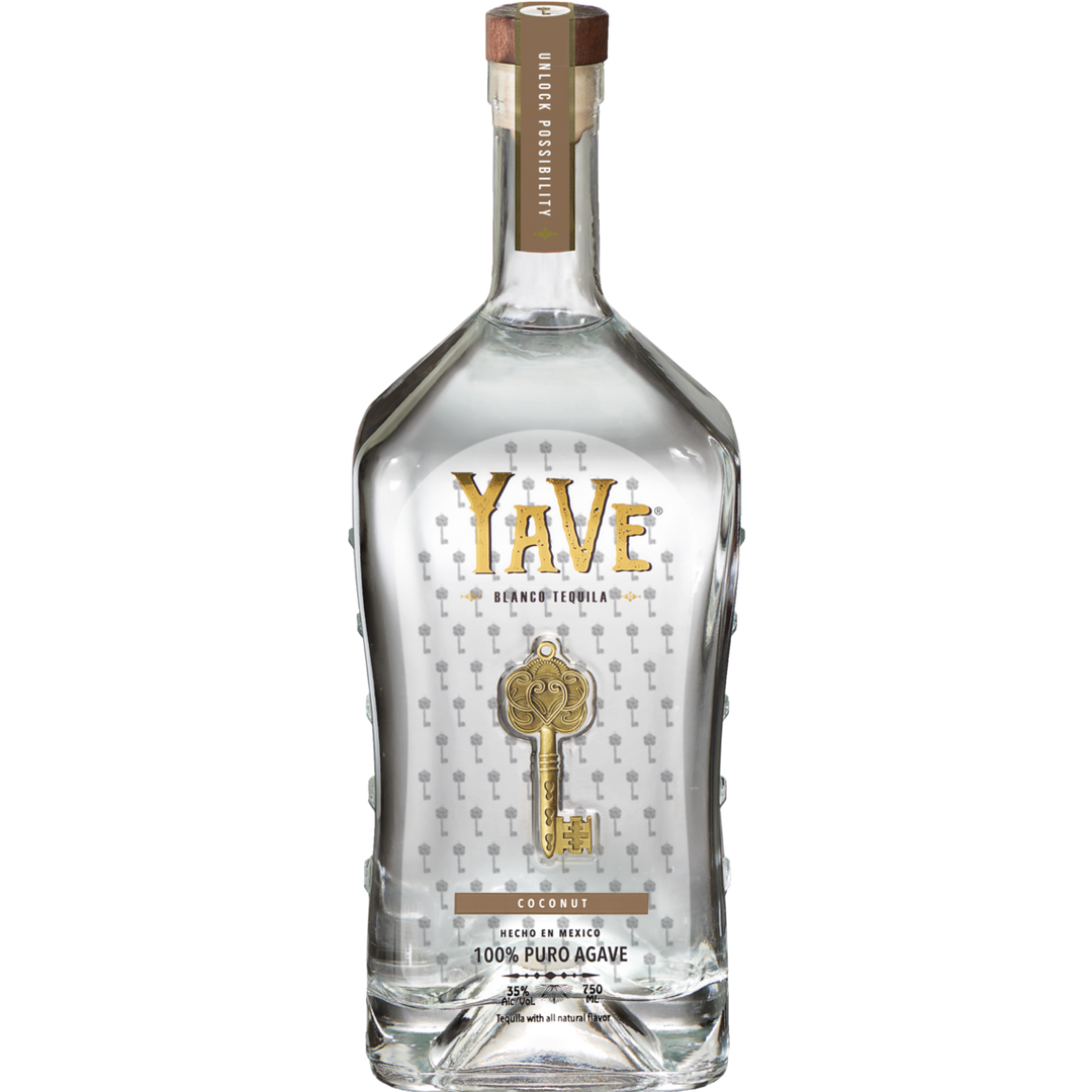 A clear bottle of YaVe Coconut Tequila by Yave Tequila, featuring gold and silver text, a key graphic, “100% Puro Agave,” and “Coconut” flavor on the label. This premium tequila comes with a stylish wooden cap.