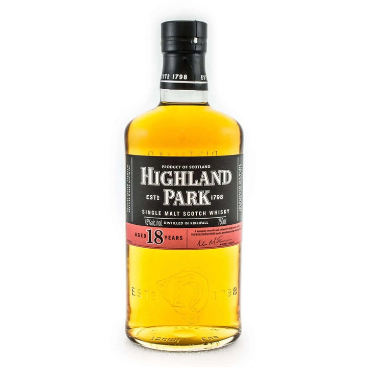 A bottle of Highland Park 18 Year Old by Highland Park, featuring a black and red label and black cap, containing golden whisky aged in sherry-seasoned European oak casks in Orkney, Scotland. "VIKING PRIDE" is displayed on the label.